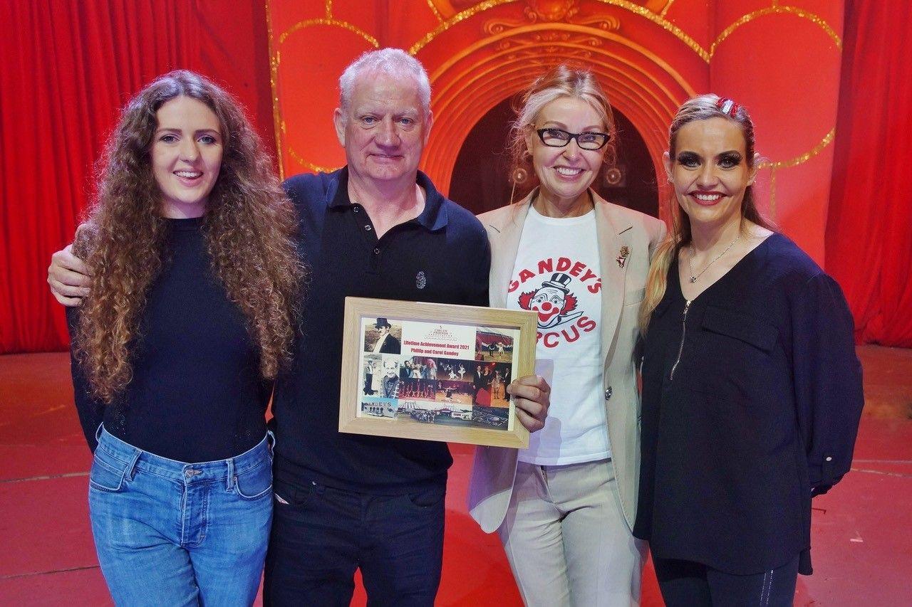 Phillip Gandey and family with a lifetime achievement award