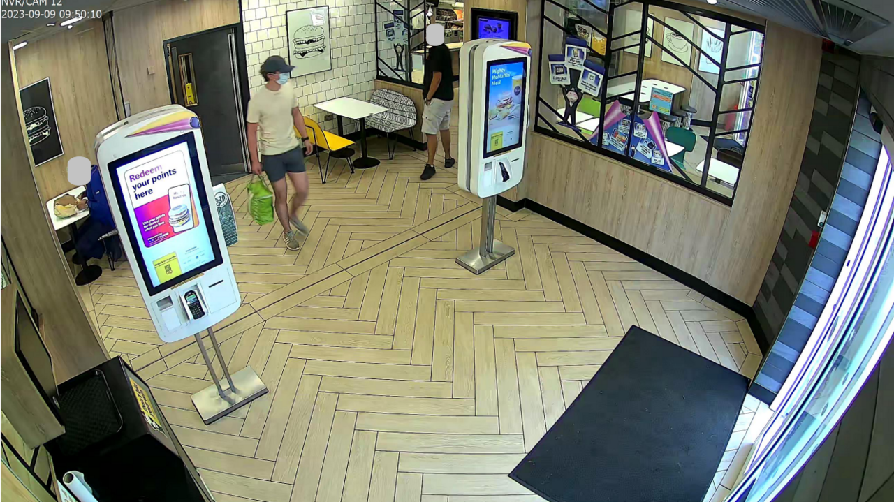 CCTV showing Daniel Khalife with a face mask and hat in McDonald's 