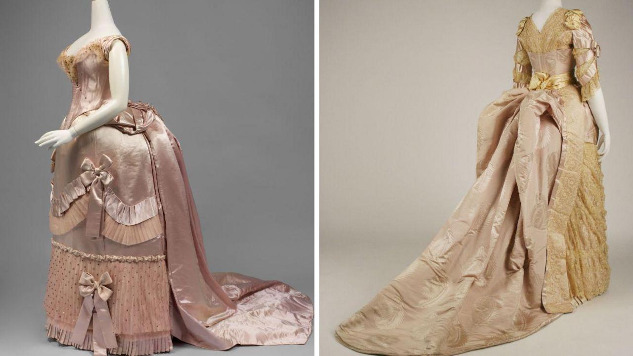 Two images of Victorian dresses. The first is a pale pink-coloured evening gown with a large bustle at the back and rose trimmings. The second is in a gold colour, with a bustle skirt that gathers silk at the back and leaves the front of the dress skirt flat.