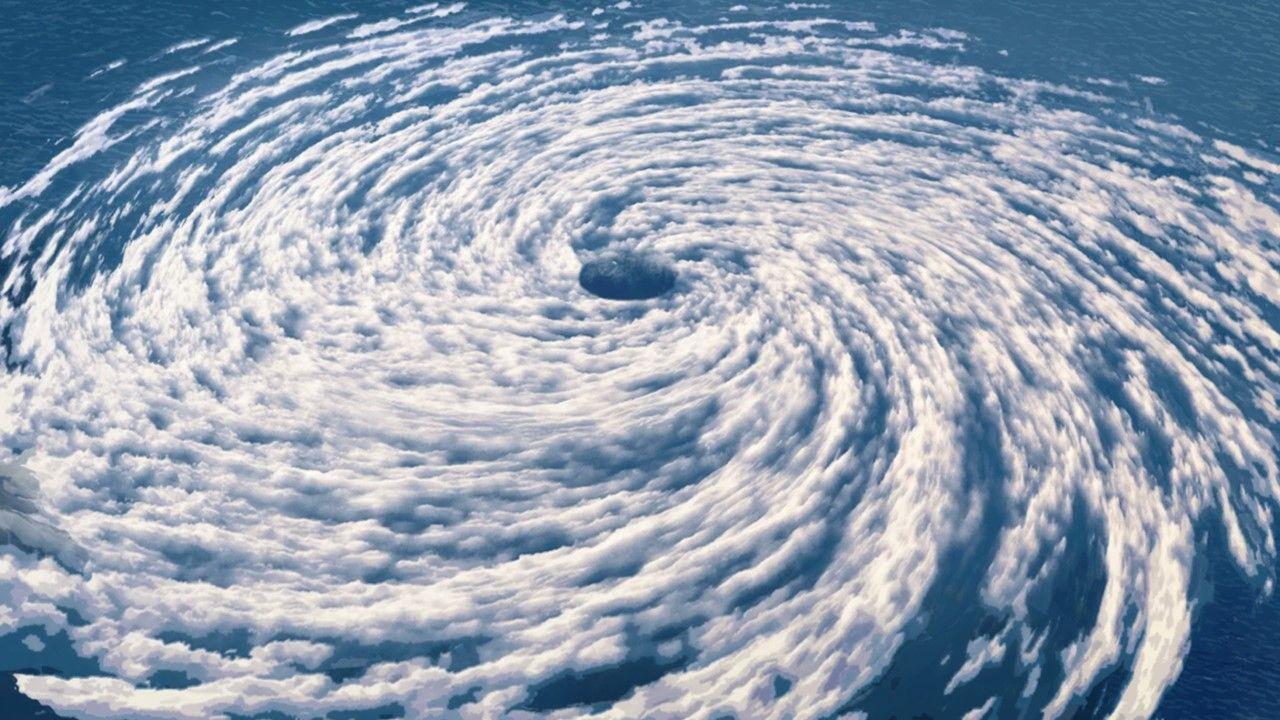 Image of a hurricane from above showing swirling clouds above the sea