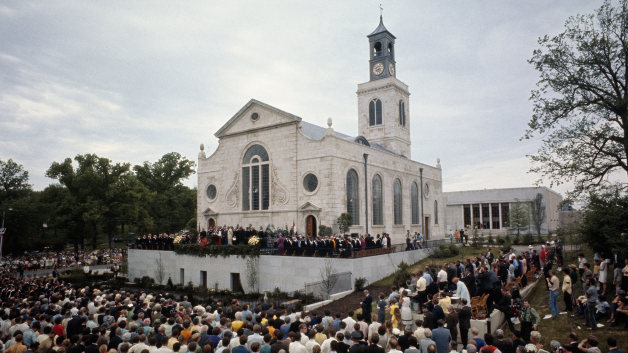 A large crowd of people sat on seats around the rebuilt St Mary Aldermanbury in Fulton, Missouri, for the rededication ceremony in 1969