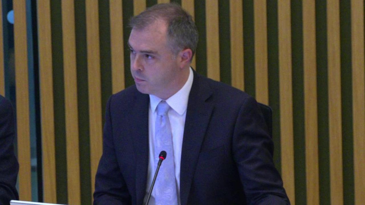 Neil Garratt sitting in assembly chamber