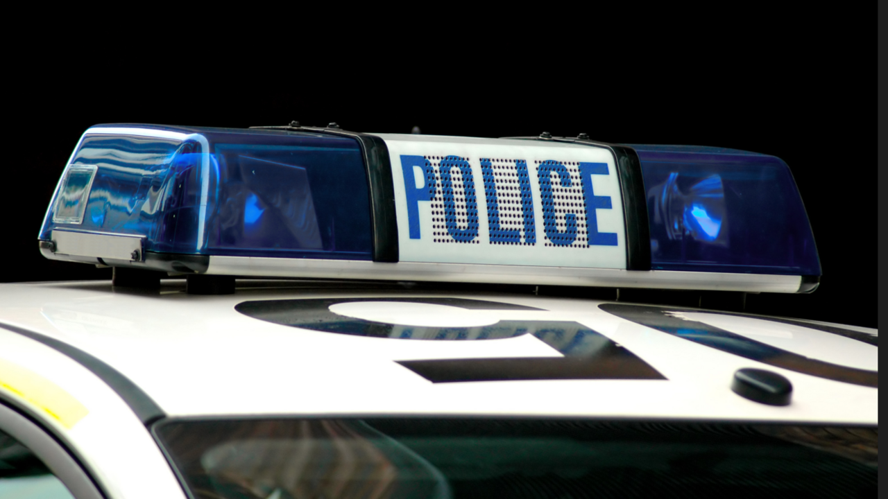 A blue light on the roof of a police car