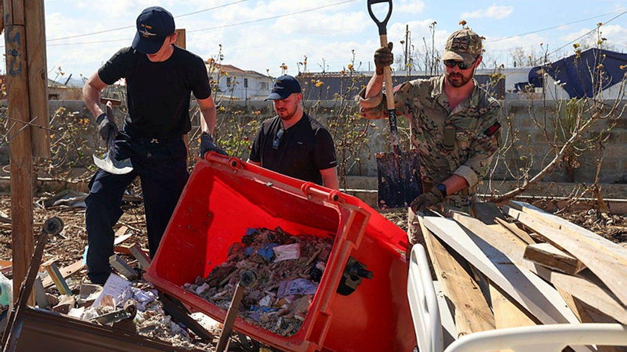 Solider collect debris outside hospital