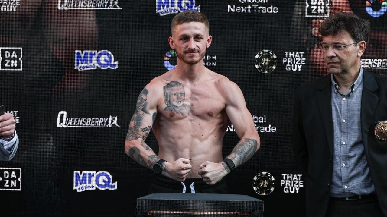 Ryan Garner poses after making weight at the weigh-in 