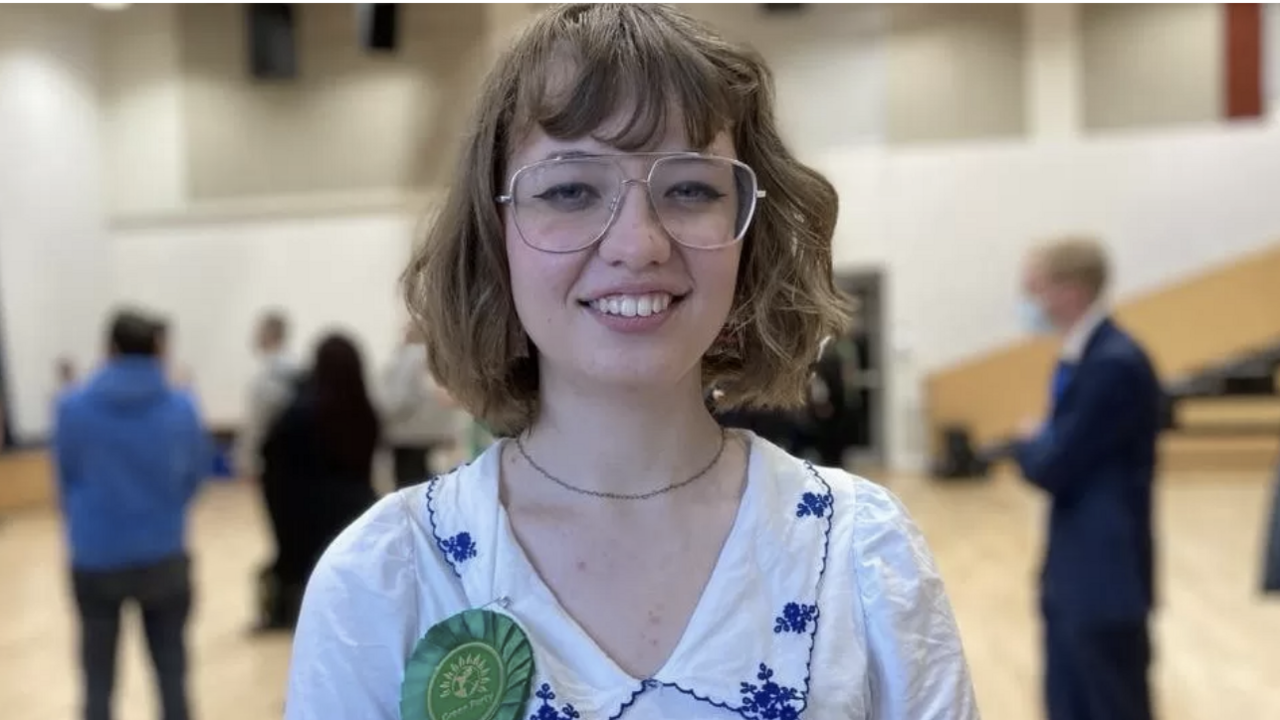 A photo of Lily Fitzgibbon standing in a hall