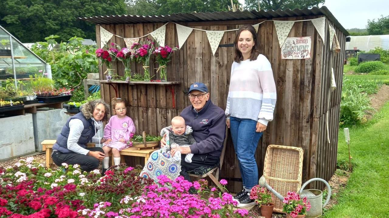 The Playfoot family outside their Four Generation Shed