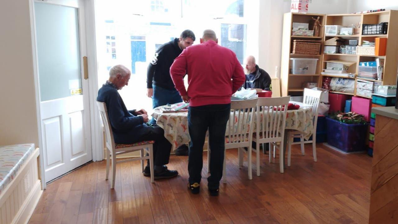 A group of men sharing an activity