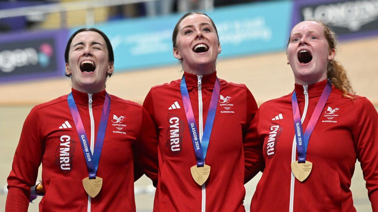 Rhian Edmunds, Lowri Thomas and Emma Finucane sing the national anthe