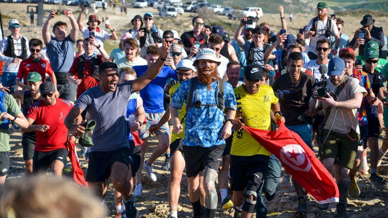 Russ Cook crossing the finish line in Tunisia