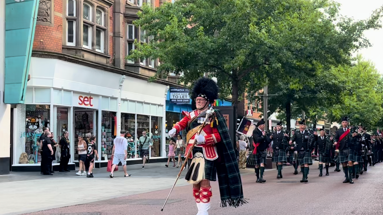 Pipers in kilts on High Street