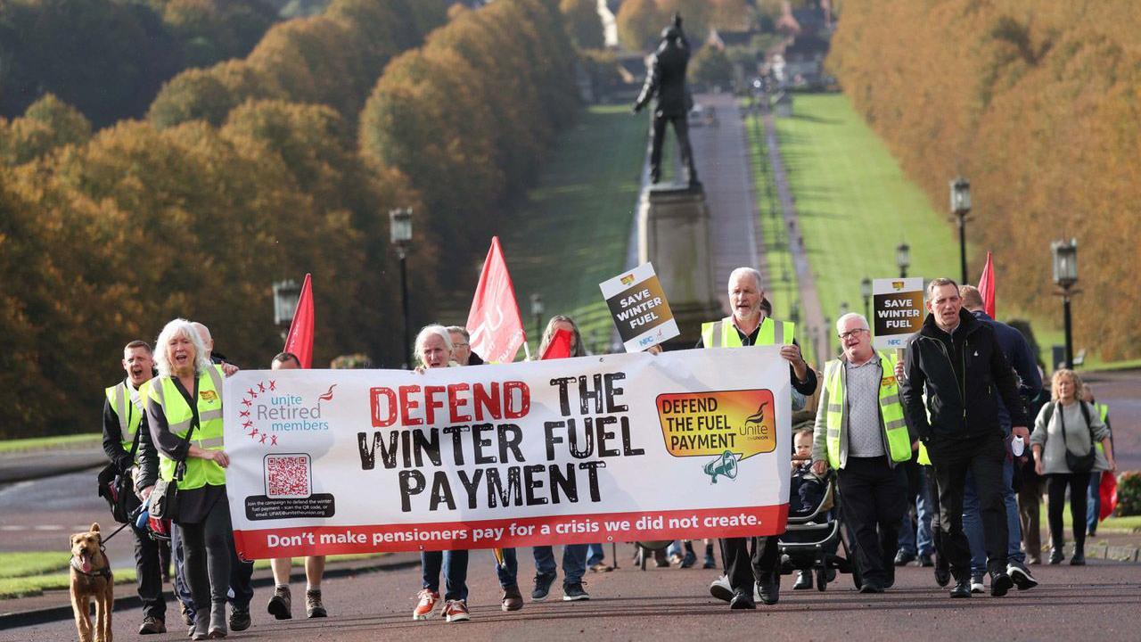 Protestors walk up Prince of Wales avenue towards parliament buildings 