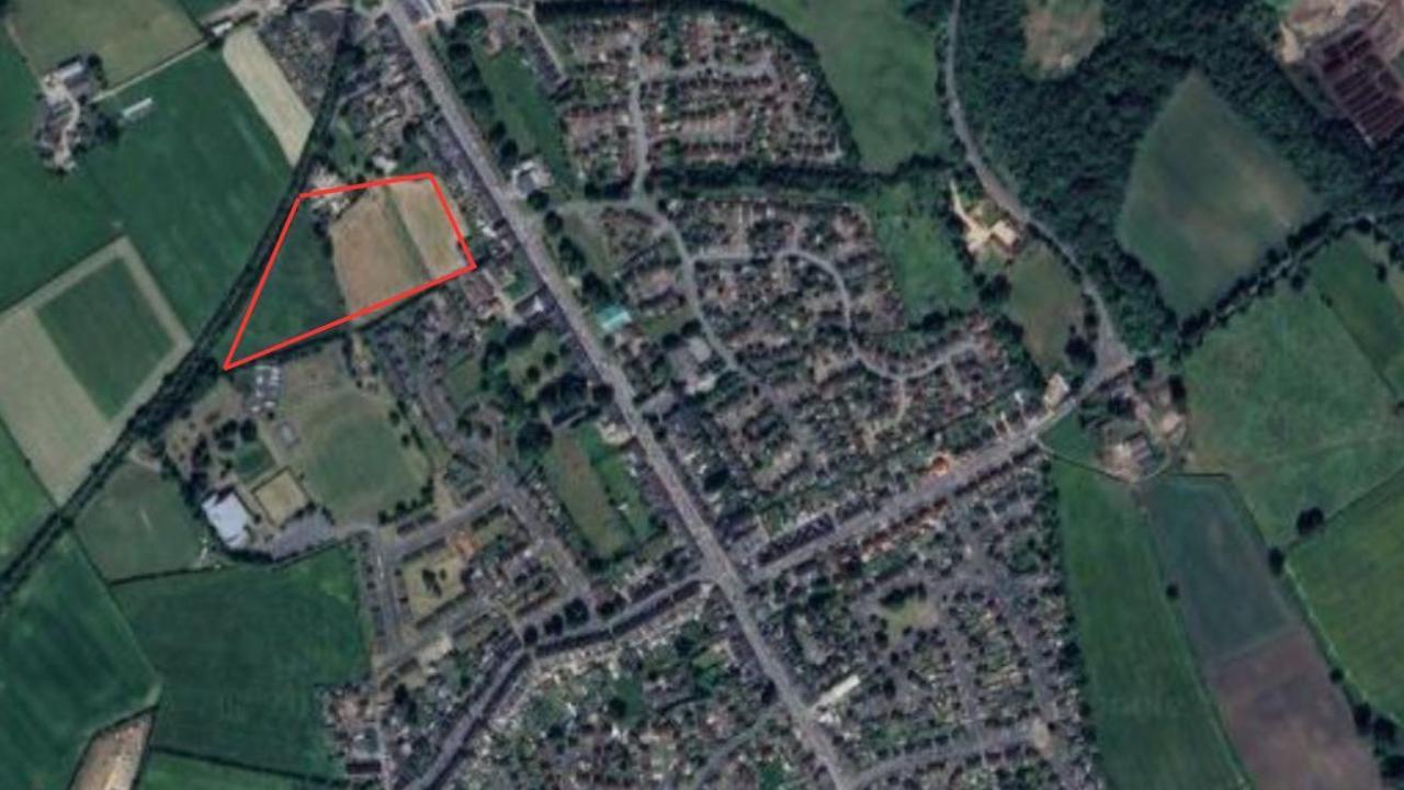 An overhead satellite view of the planned housing estate, and the surrounding village of Coxhoe, with the site outlined in red.