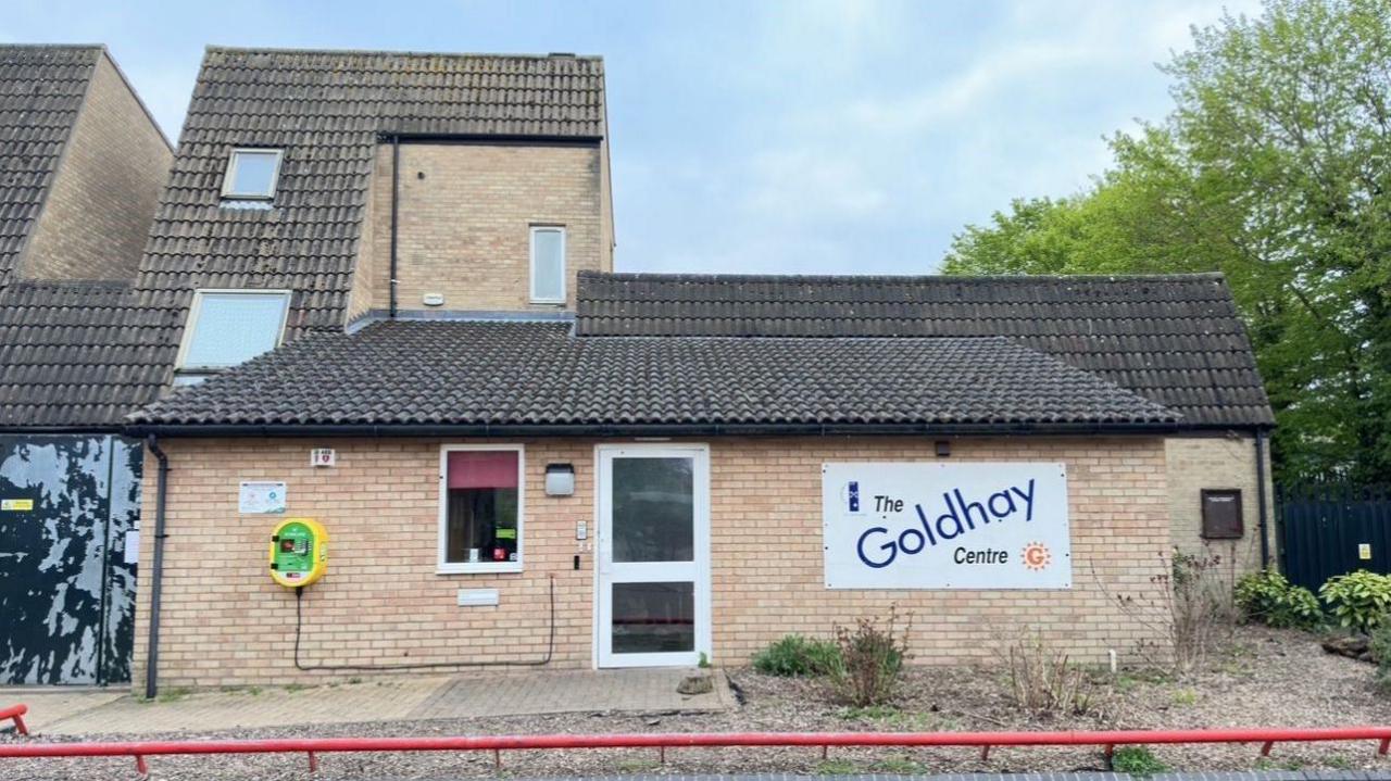 A two-storey modern brick building with a sign on the front saying The Goldhay Centre 