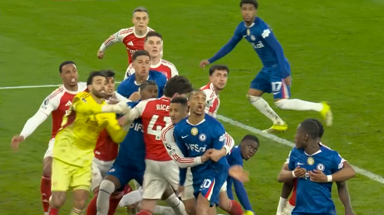 Arsenal and Chelsea players compete for the ball as it comes in from a corner