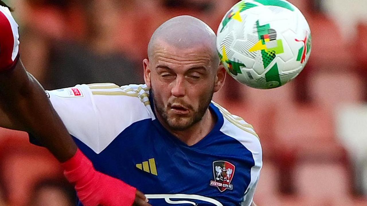 Pierce Sweeney heads a ball