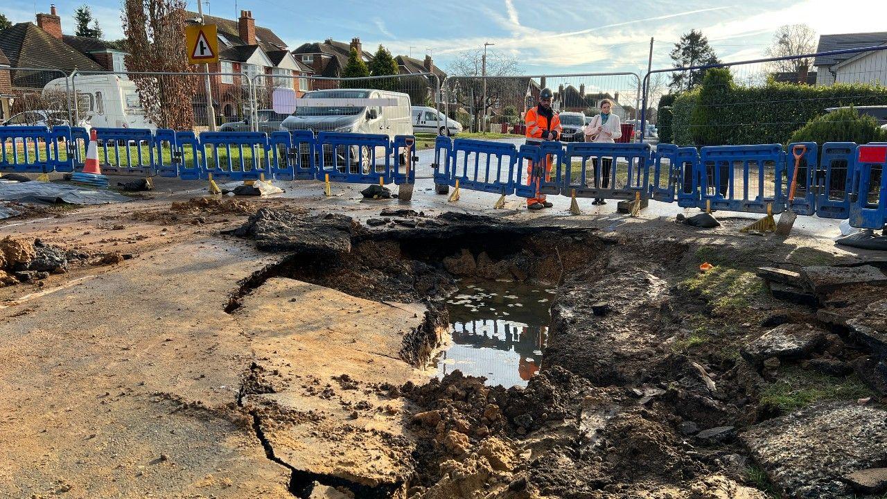 Burst water pipe on Kidmore Road, Caversham Heights, Berkshire