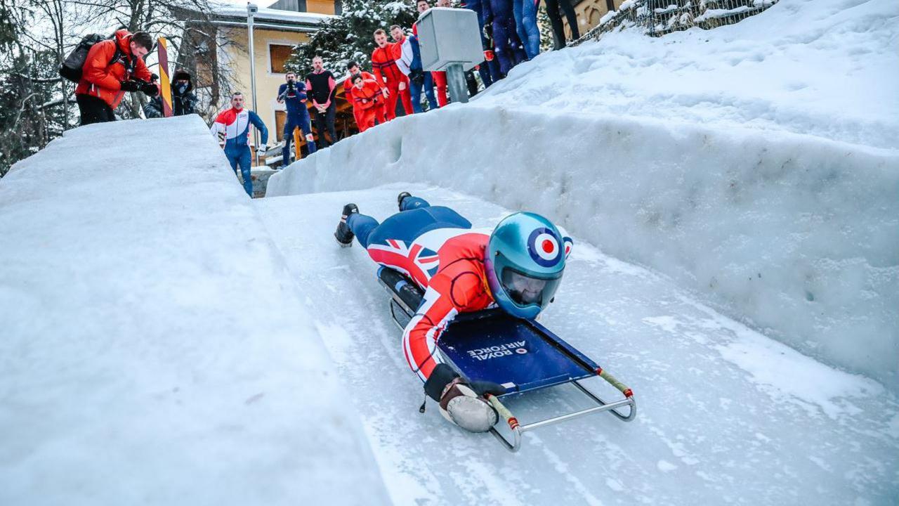 Flight Lieutenant Mimi Hobbs on a toboggan 