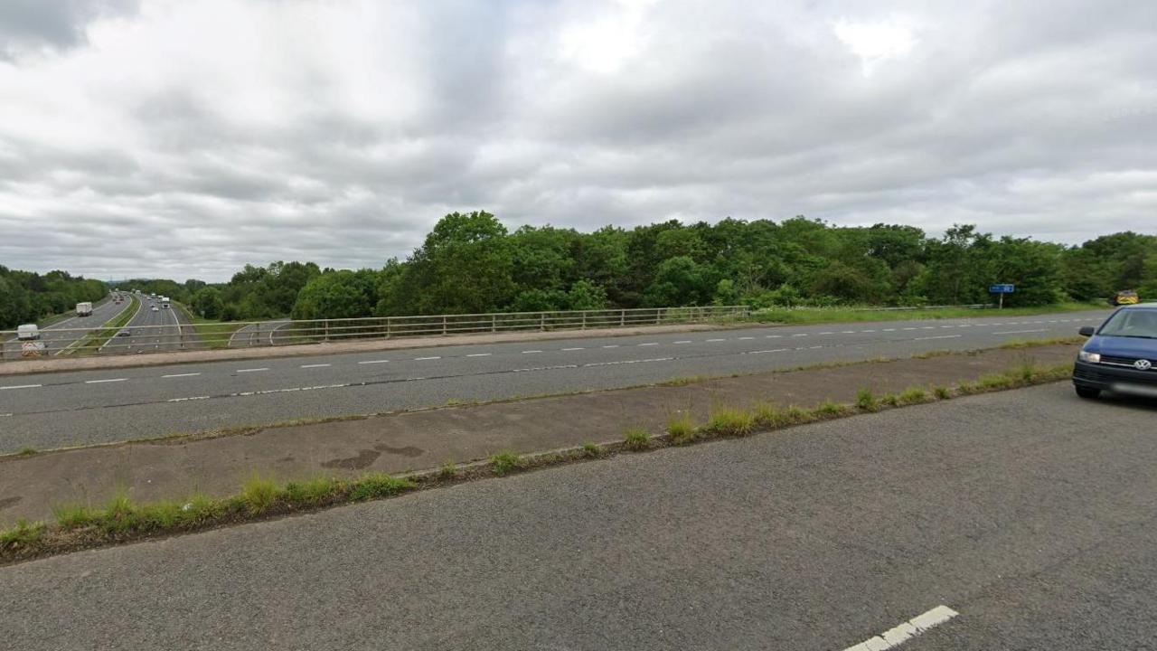 A bridge which had a concrete verge in the middle of its six lanes going over the M5 motorway.