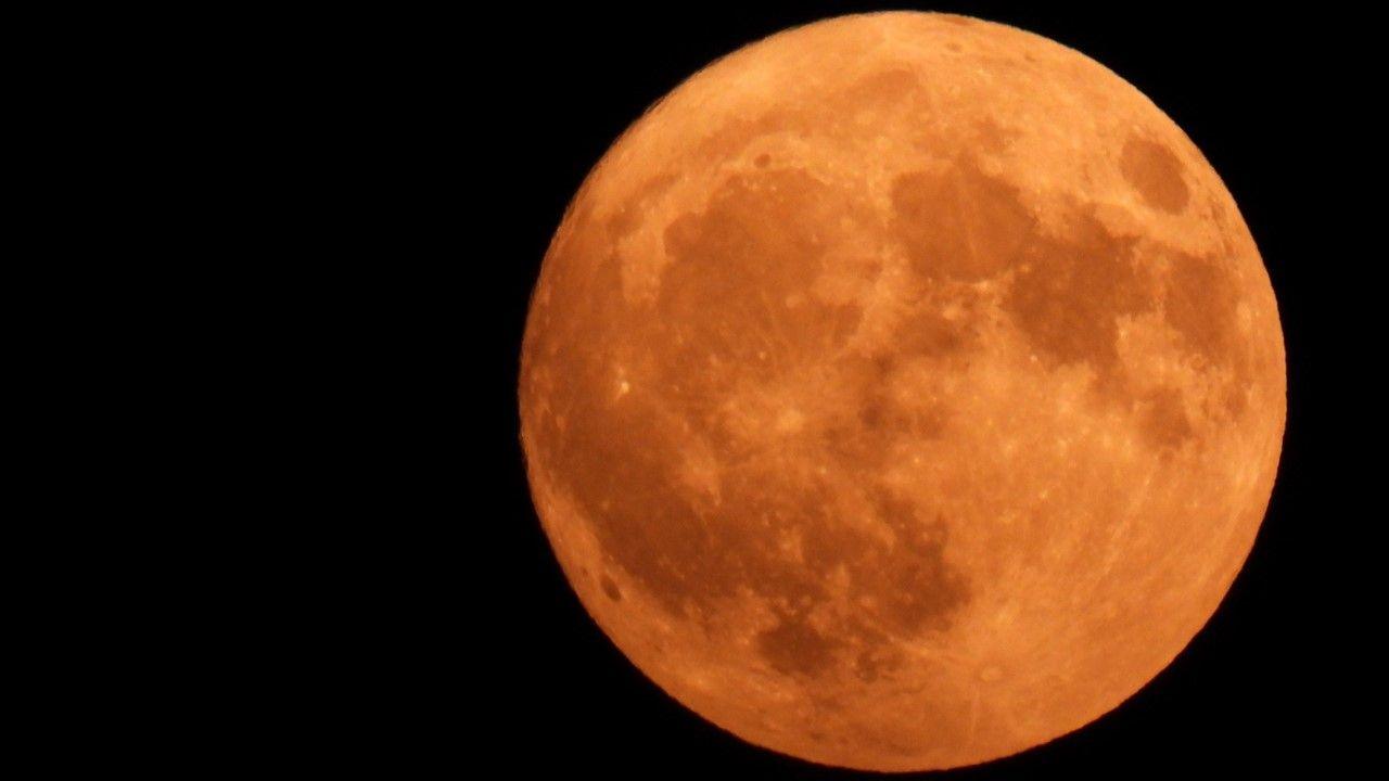 Large orange almost full Strawberry Moon