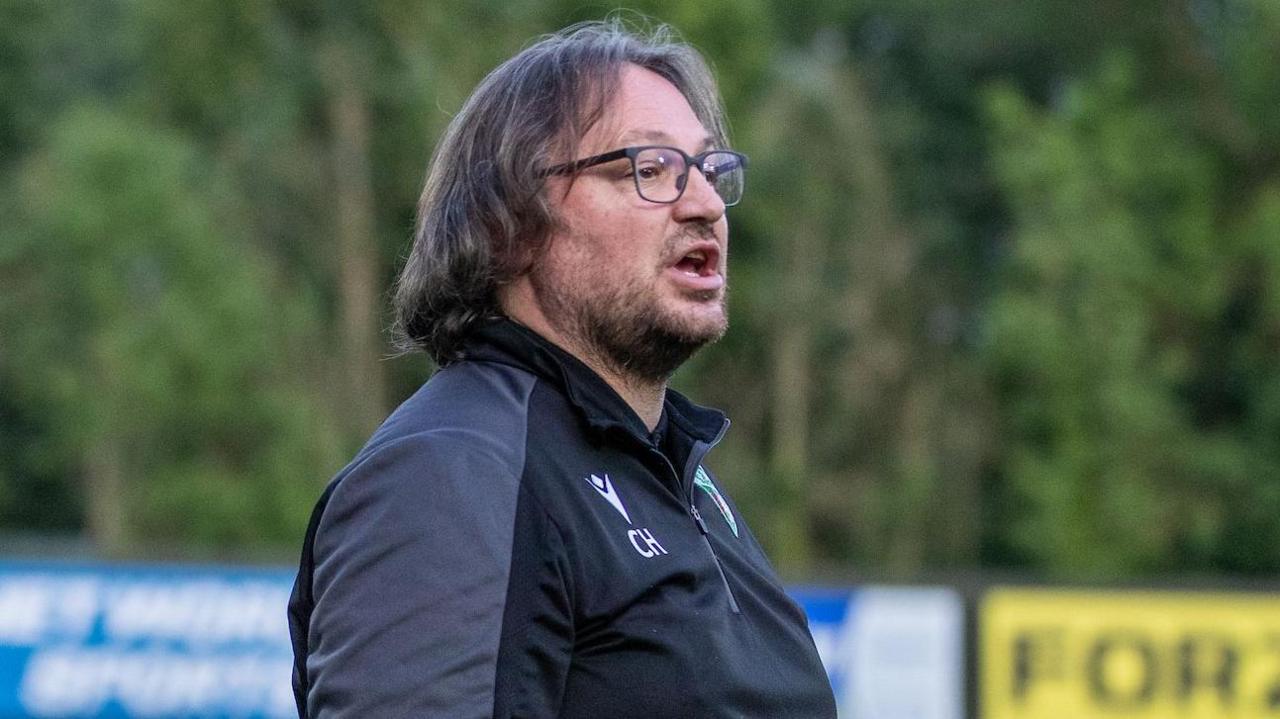 Craig Harrison looks on from the touchline