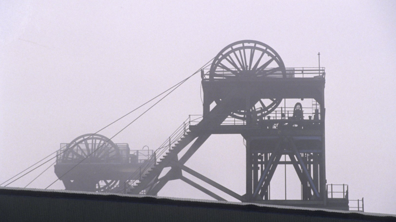 The silhouette of winding gear at an unidentified coal mine.