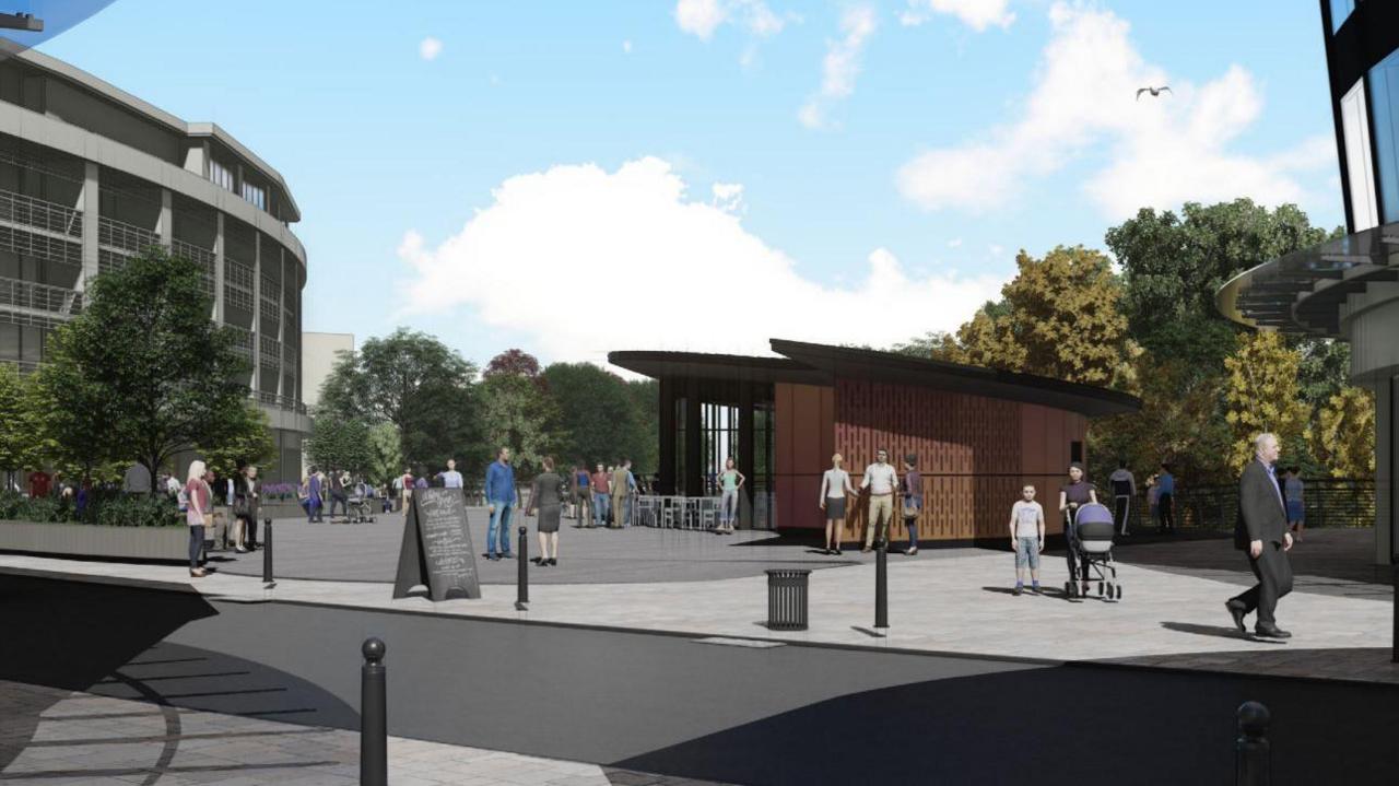 An artist's impression of how the decked over area would look. It shows a brown building on top of grey decking