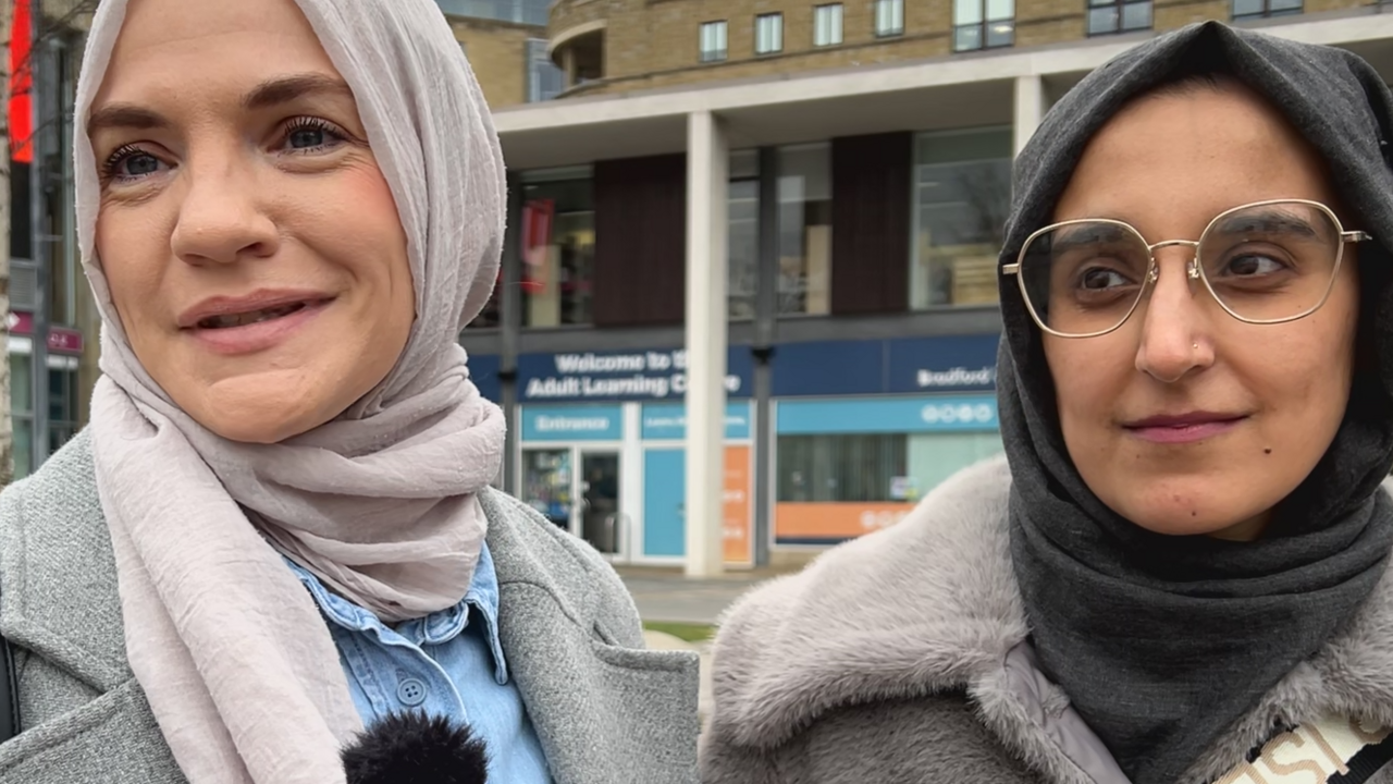 Friends Maryam Sultan and Ujala Aftab. Two South Asian ladies, both wear headscarves and woolly coats.