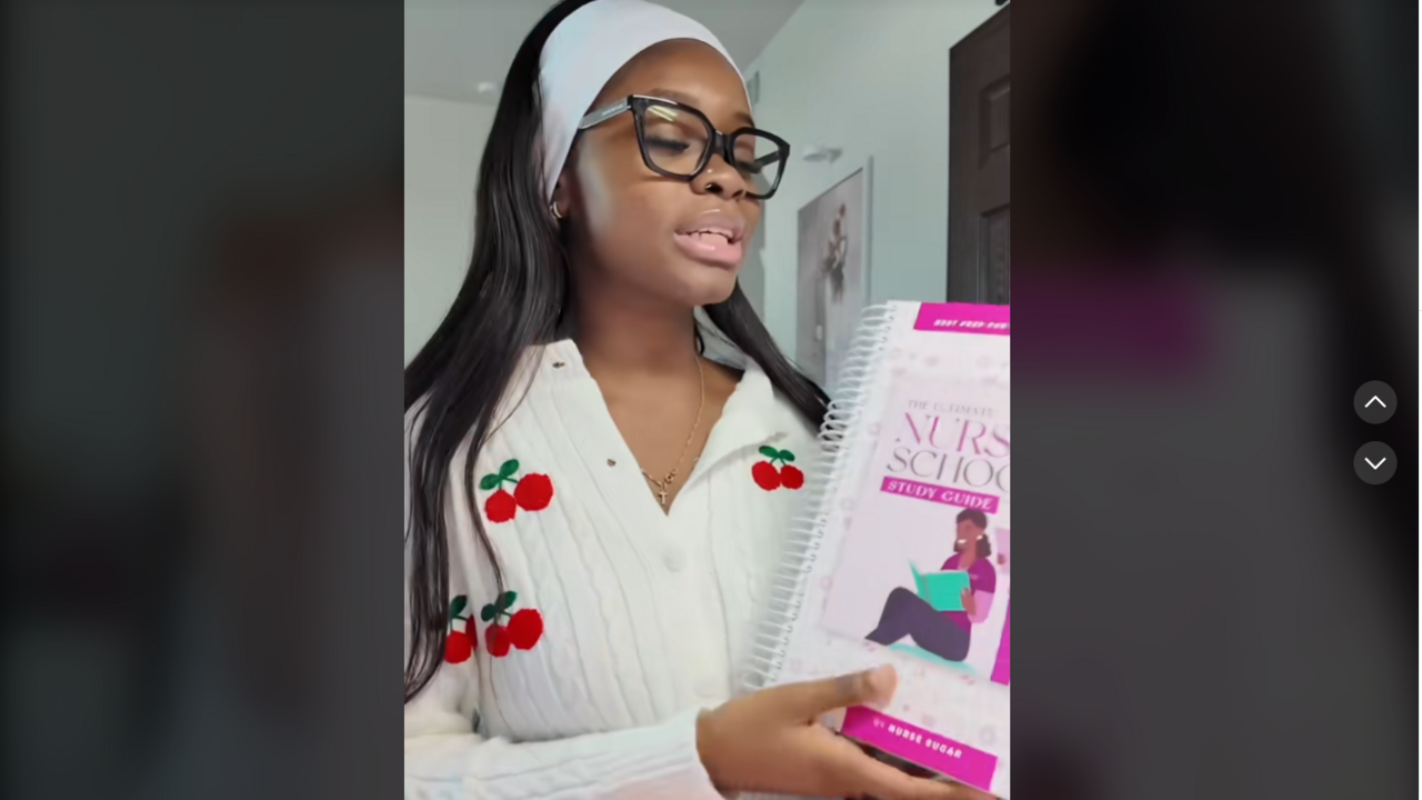 Tami Odunsi holding a nursing school book in a TikTok video
