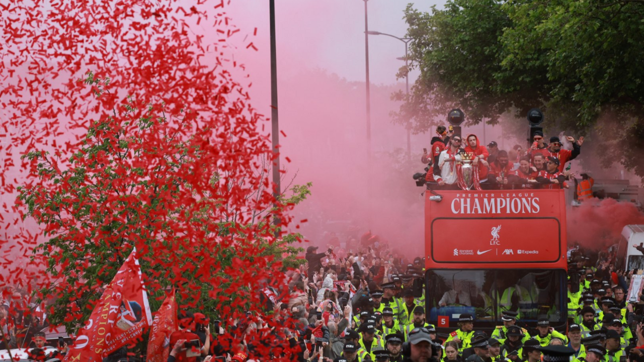 Liverpool's open-top bus surrounded by red