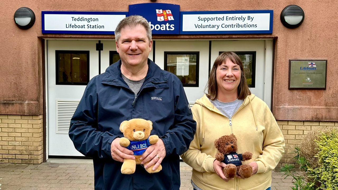 Allan and Helen Thornhill at Teddington RNLI, both are holding RNLI teddies