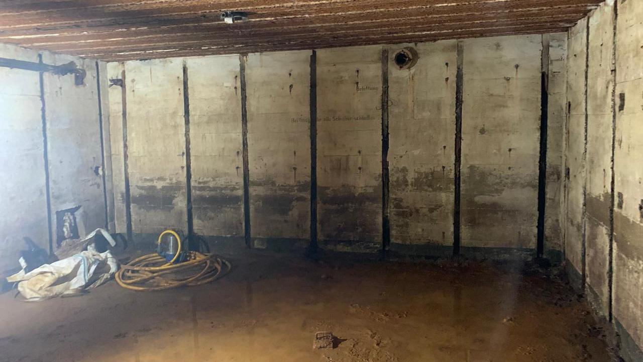 Inside a German World War Two bunker found under a house in Guernsey. Water has flooded the floor.