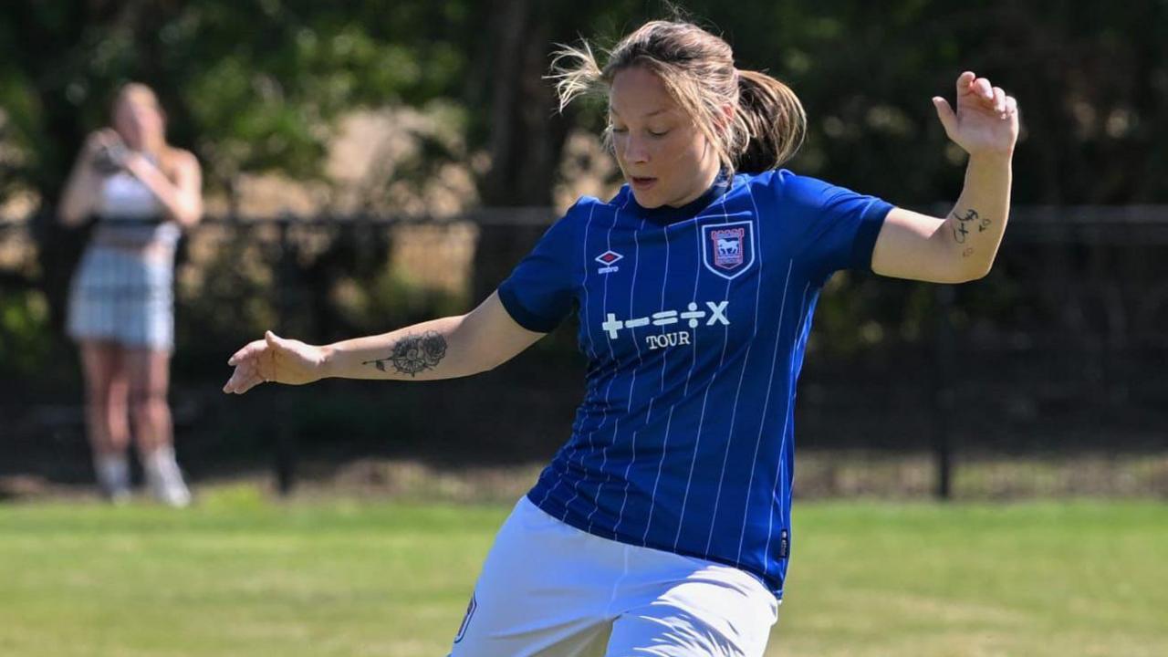 Angela Addison playing at an Ipswich Town game 