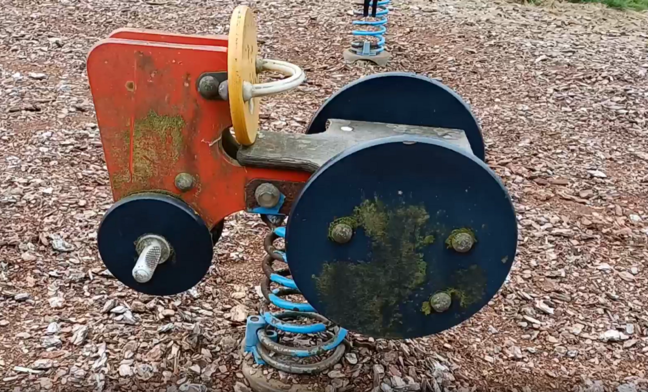 A musty tractor on a spring