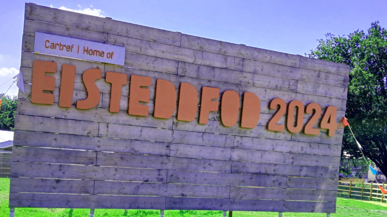 Large sign in Ynysangharad Park, Pontypridd, with the words Eisteddfod 2024