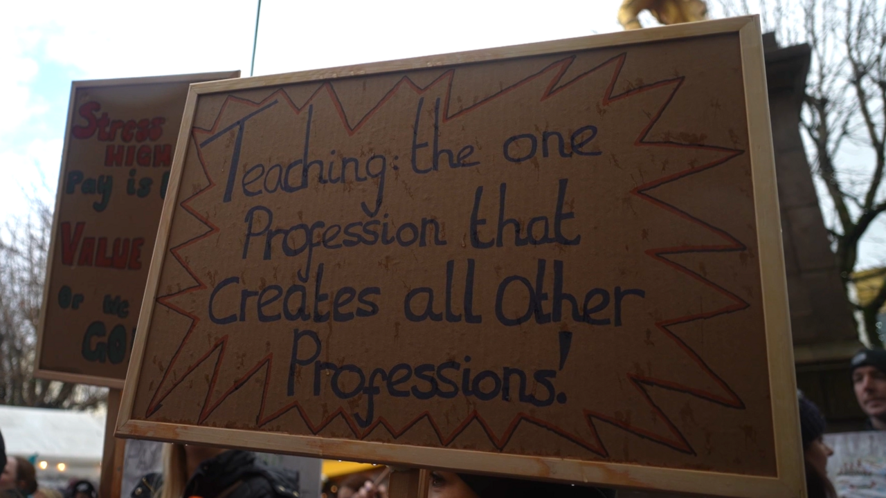 Teacher strike sign that says 'Teaching: the one profession that creates all other professions!'