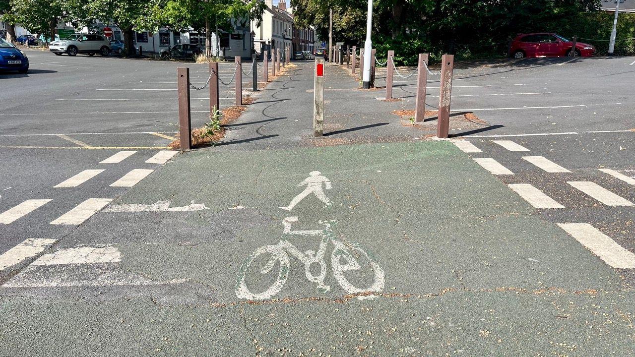 An imag showing a pedestrian and a bicycle to show a shared use path in Newtown, Exeter