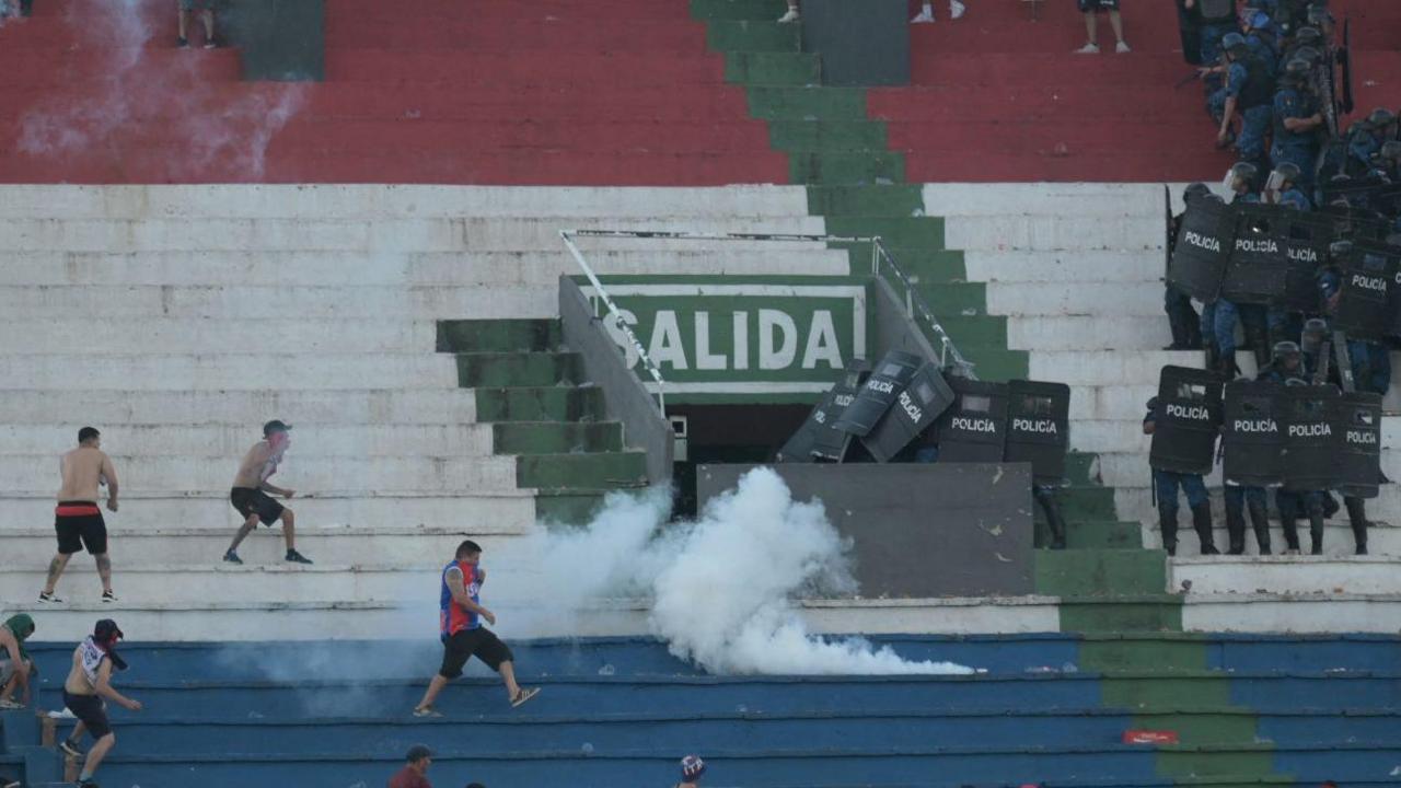 Police fire tear gas in an attempt to quell trouble during a game between Olimpia and Cerro Porteno in the Paraguay captial Asuncion.