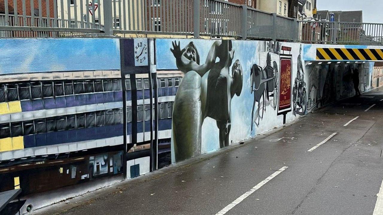 A part of the mural showing the clock tower and the town centre in Stevenage.