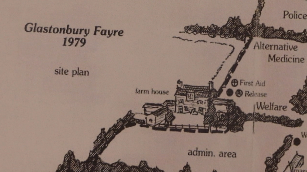 A map with black and white drawings of farm houses. It says Glastonbury Fayre 1979 site plan on the side of the drawings.