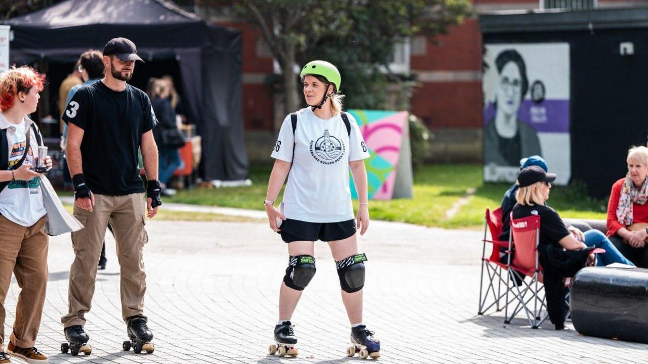 A woman on skate rollers.