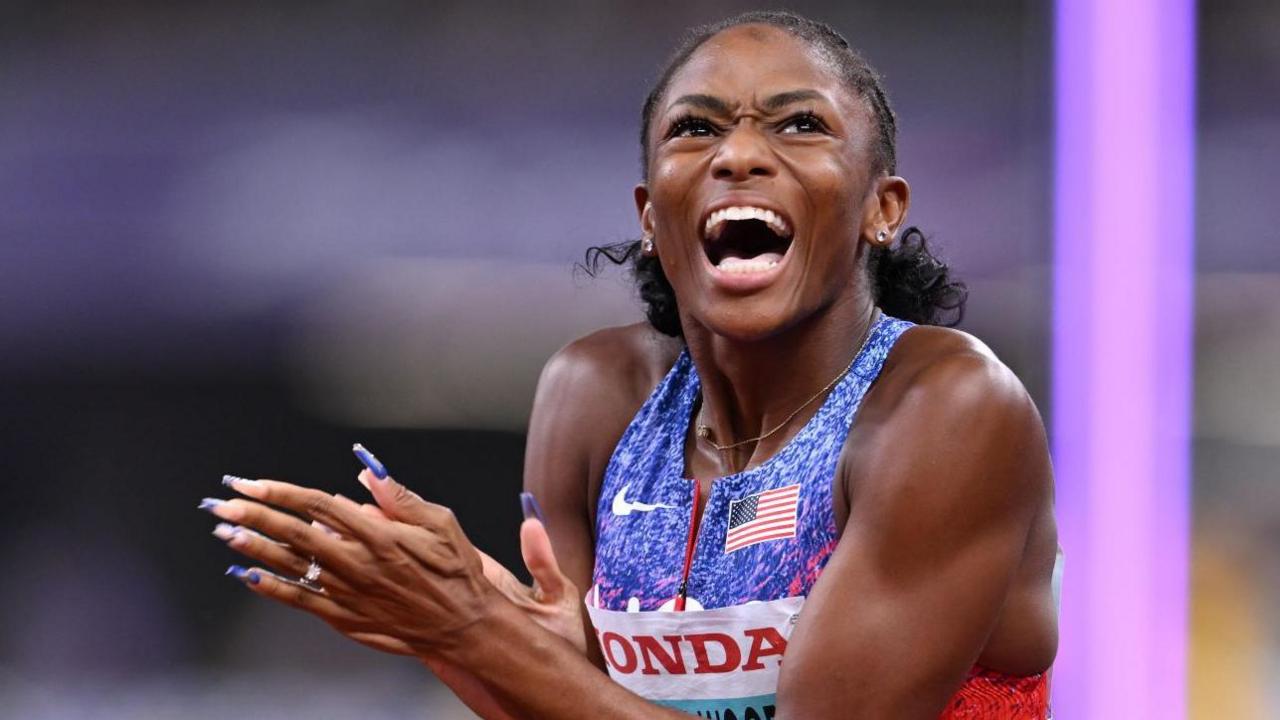Melissa Jefferson-Wooden celebrates after winning world 100m gold