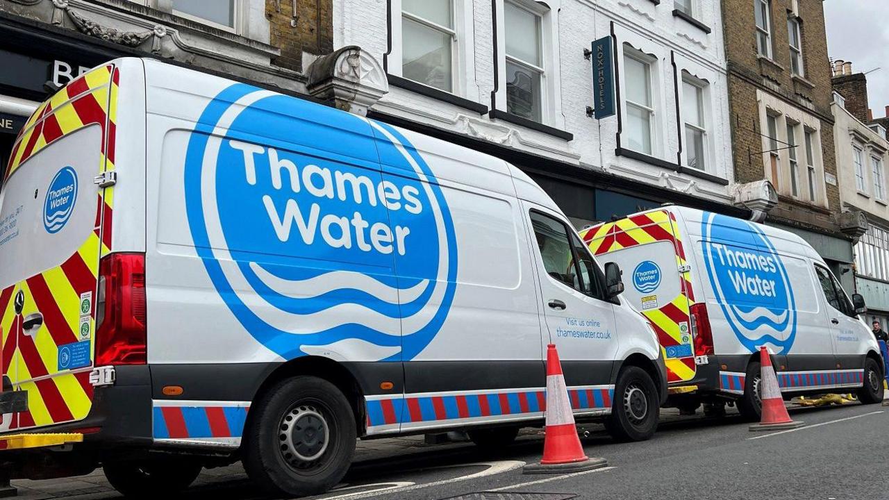 Two Thames Water vans parked by the side of the road