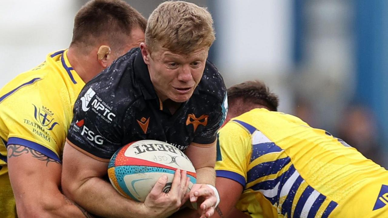 Ospreys centre Keiran Williams carries the ball hard against Zebre Parma in Bridgend