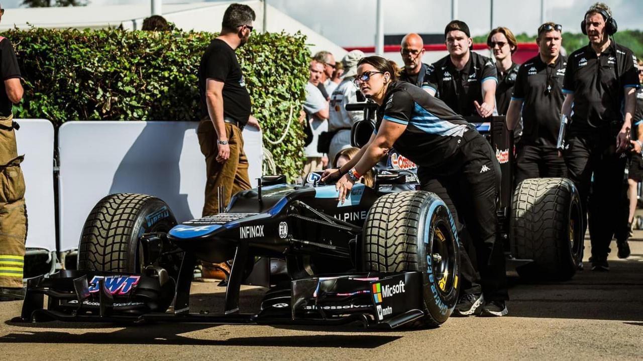 Cleo Collins works on a car