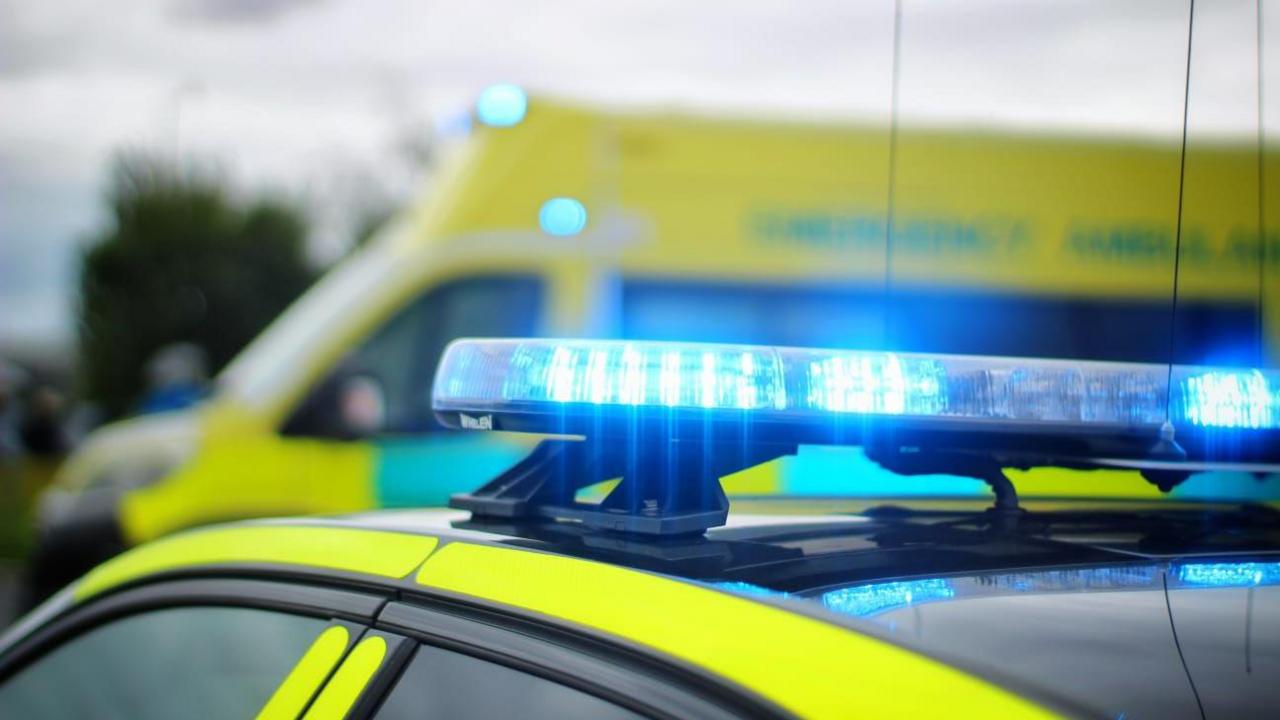 Library image of emergency vehicles with their blue lights flashing