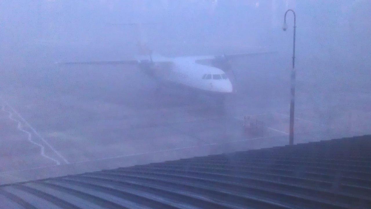 An aircraft at a foggy airport