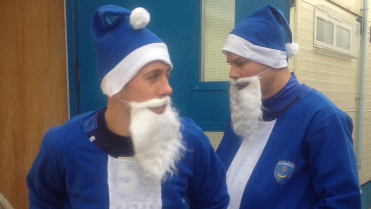 Portsmouth FC footballers Jon Harley and Johnny Ertl model the blue Santa suits