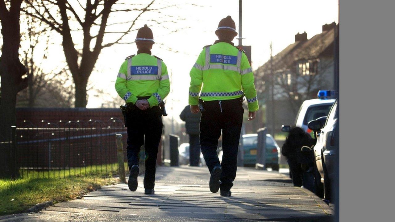 South Wales Police officers patrol the streets of Rumney, Cardiff