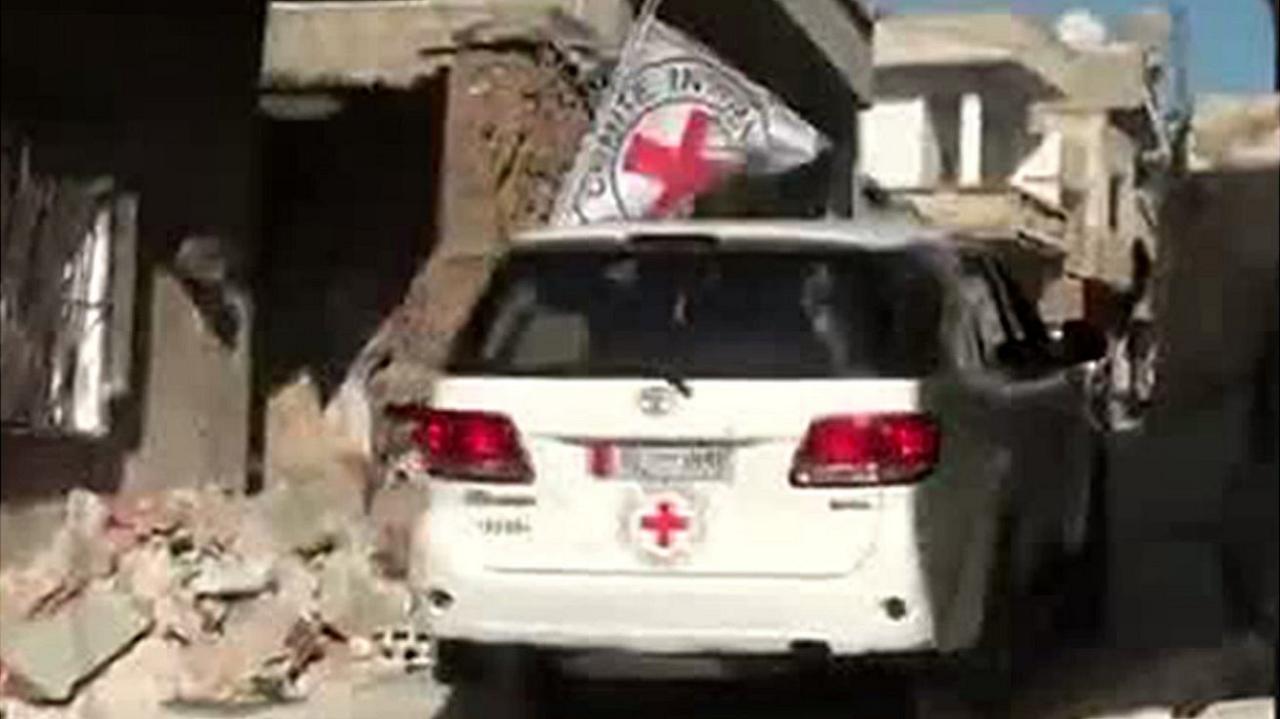 File pic Red Cross vehicle in Rastan, Syria (2012)